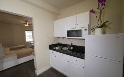 A Kitchen With White Cabinets