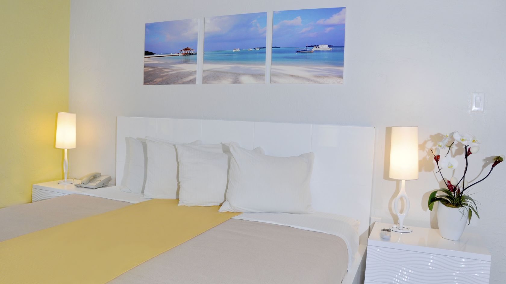 A Bedroom With A Bed And Desk In A Room